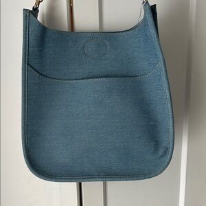 Ahdorned Elegant Denim Blue Shoulder Bag with strap.